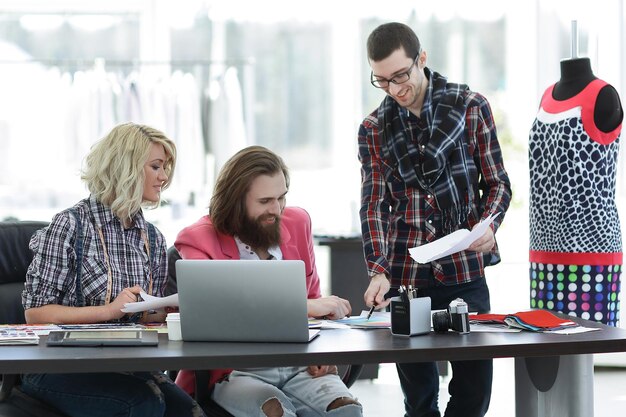 Group of designers discussing new ideas in a modern Studio