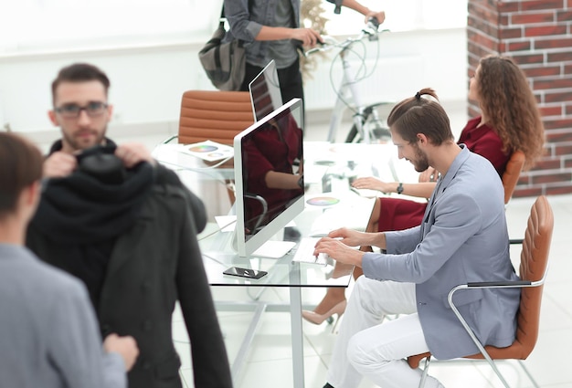 Group of designers and tailors working in the Studio photo with copy space