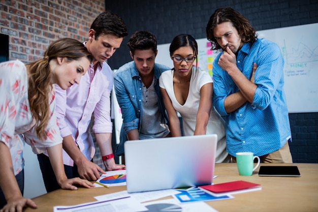 Group of designers working on a computer