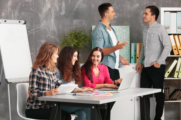 group of designers working at office