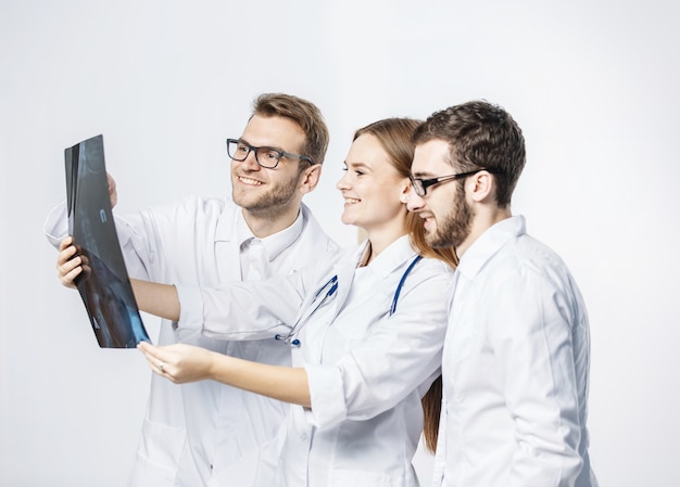 Group of diagnosticians with xrays on a white background.