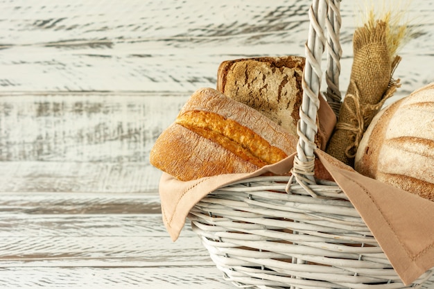 Group of different bread's type on wooden table.