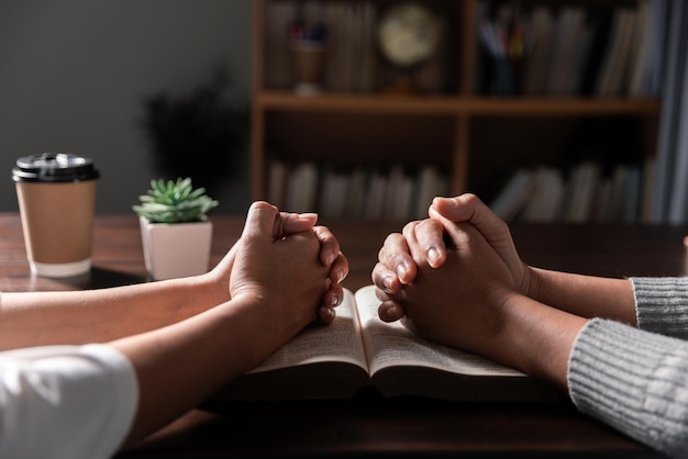 Photo group of different women praying together christians and bible study concept