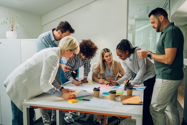 Photo group of diverse business people working together and having a meeting