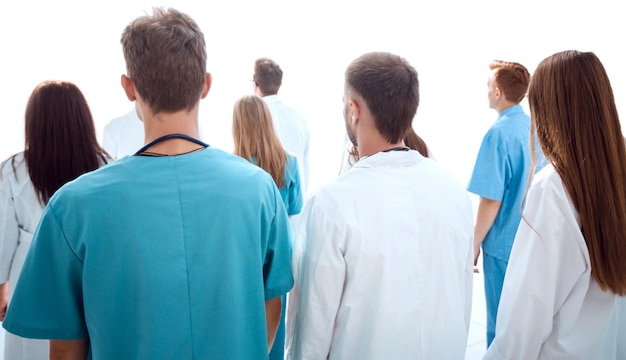 Group of diverse doctors looking at the blank screen