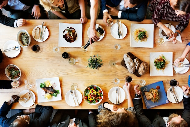 Group of diverse people are having lunch together