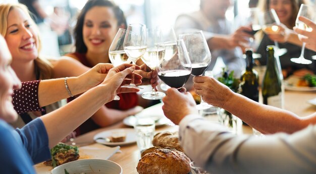 group of diverse people are having lunch together