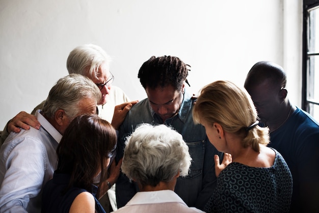 Group of diverse people gathering together support teamwork