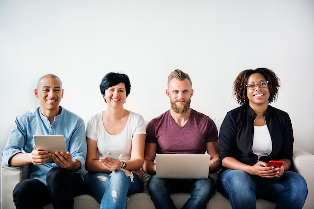 Photo group of diverse people using digital devices