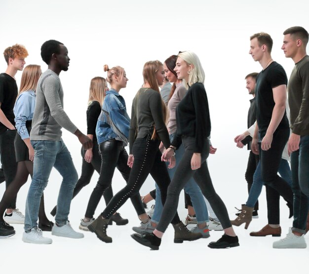 Photo group of diverse young people pointing up