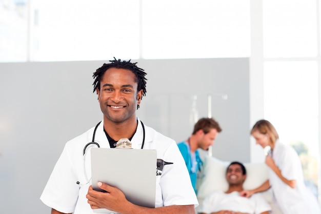 Photo group of doctors attending to a patient