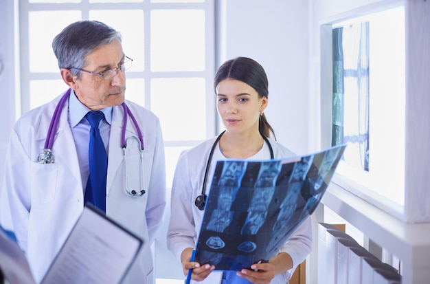 Group of doctors checking x-rays in a hospital