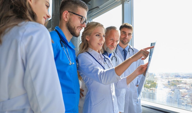 Group of doctors checking xrays in a hospital