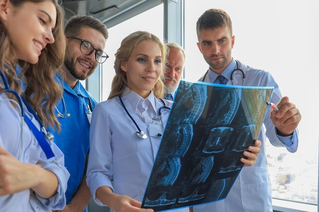 Group of doctors checking xrays in a hospital