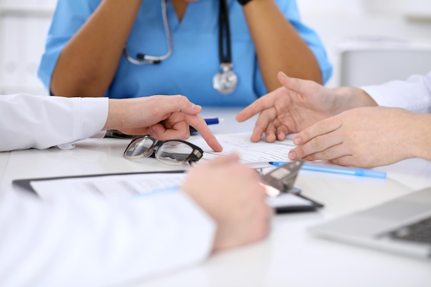 Group of doctors discuss at meeting