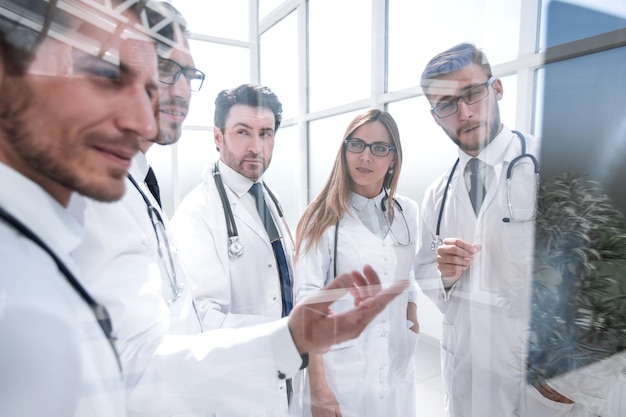 Group of doctors discussing the patients xray