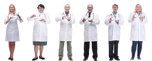 Group of doctors holding jar isolated on white