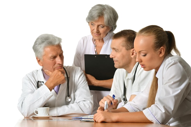 Group of doctors on meting isolated on white background