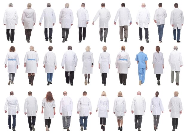 Group of doctors in motion isolated on white