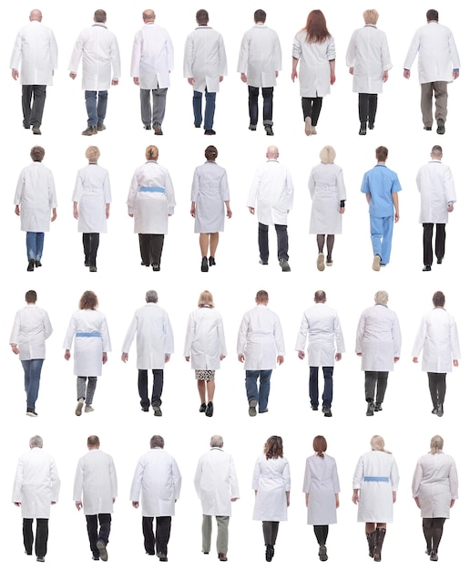 Group of doctors in motion isolated on white