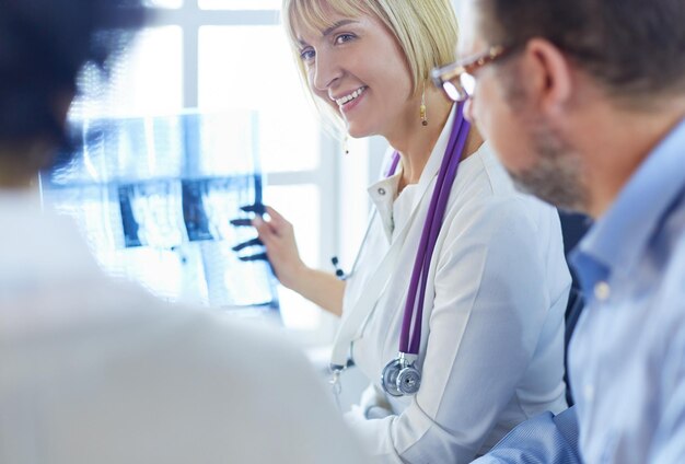 Group of doctors and nurses looking at Xray