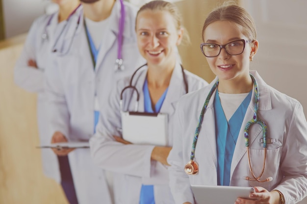 Group of doctors and nurses standing in the hospital room