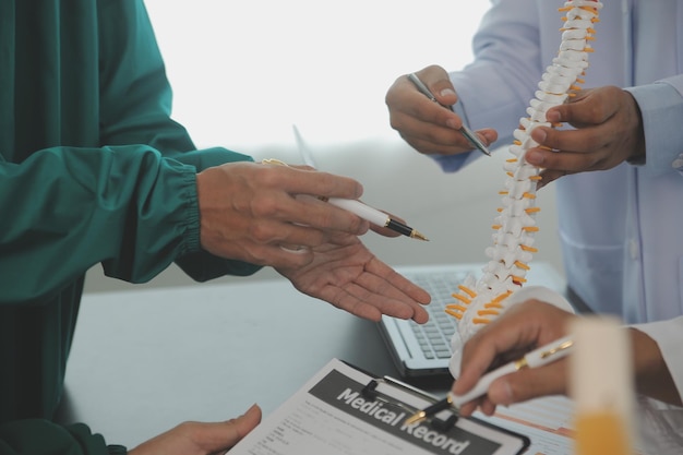 Group of doctors reading a document in meeting room at hospital