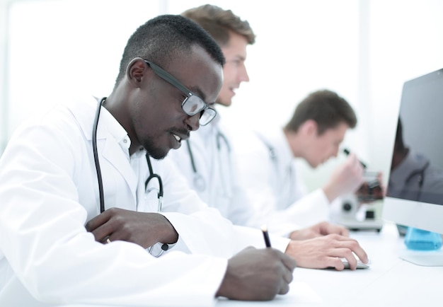 Group of doctors sitting in the laboratory