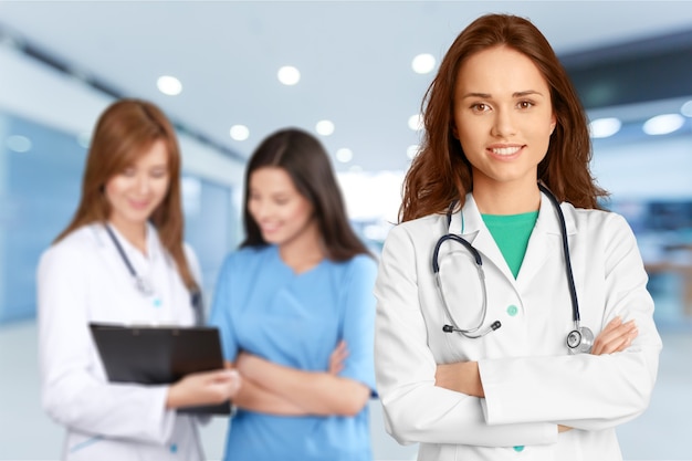 Group of doctors standing together against white