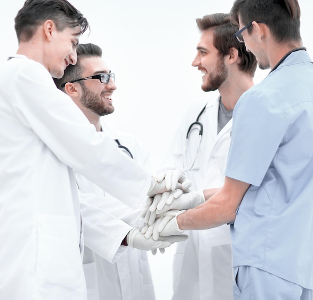 Group of doctorsclasped their hands together