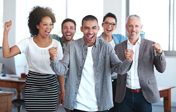 Photo group employee or celebrate with fist pump in office for win collaboration or success with smile team business people or achievement with inclusion or support in company staff with hands for yes