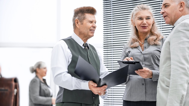 group of employees discussing documents