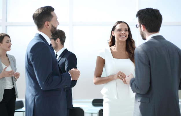 Group of employees standing in the officeoffice weekdays