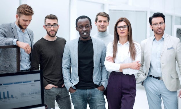 Group of employees standing in the officethe concept of teamwork