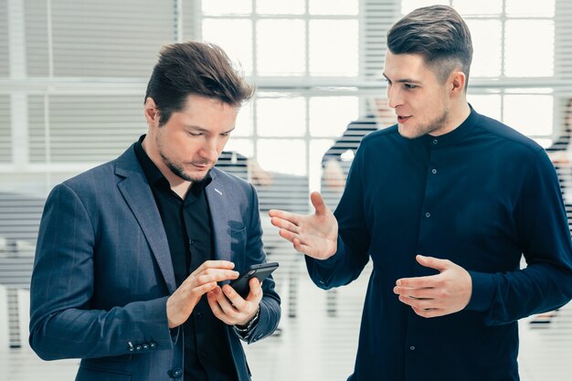 Group of employees talking standing in the office