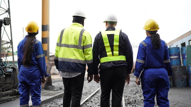 Group of engineer and workers at railwaytransportation facility\
industry business