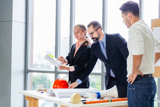 Group of engineers discussing business plan together