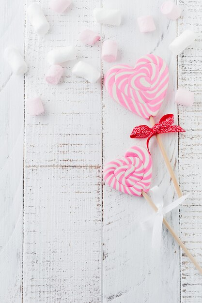 Group of festive various candies in form of heart