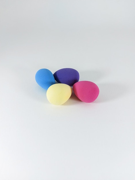 A group of five egg shaped objects on a white background.