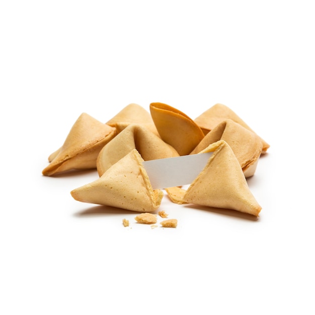 A group of fortune cookies with a note on white background. Taken in Studio with a 5D mark III.