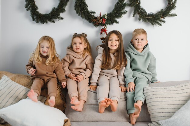 Group of four children with presents on Christmas party