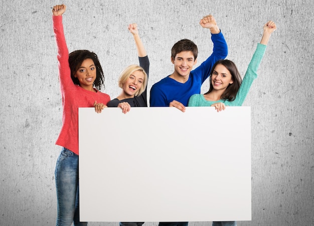 Photo group of four people holding blank card