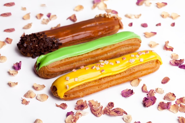 Group French dessert Eclair on a gray background plate