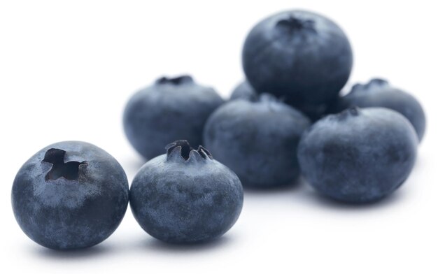 Group of fresh blueberries over white background