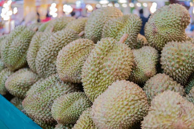 Photo group of fresh durians in the durian market.