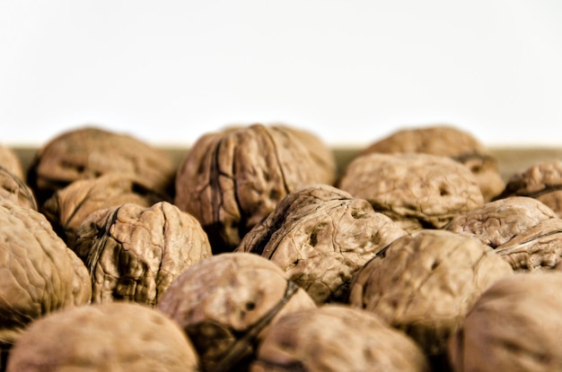 Group of fresh walnuts on white background.