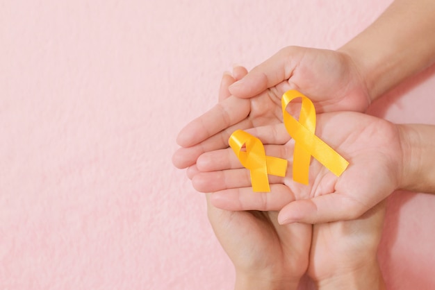 Group friend hands cancer ribbon symbol view from above with vintage style of picture.