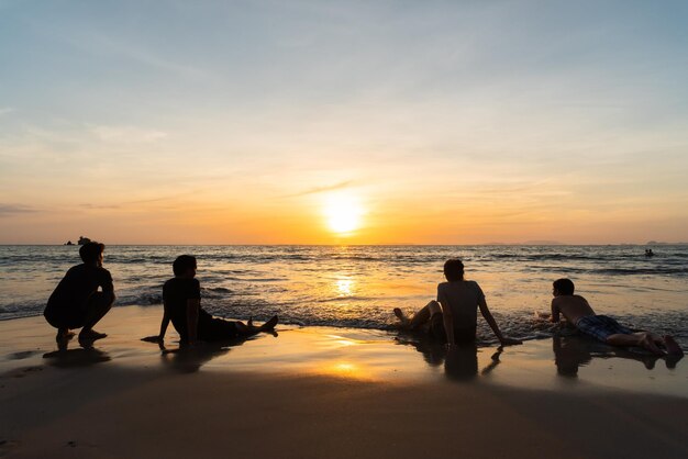 Photo group of friend when watch sunset at phayam island  ranong thailand