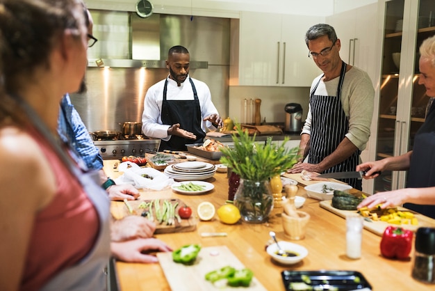 Group of friends are cooking in the kitchen