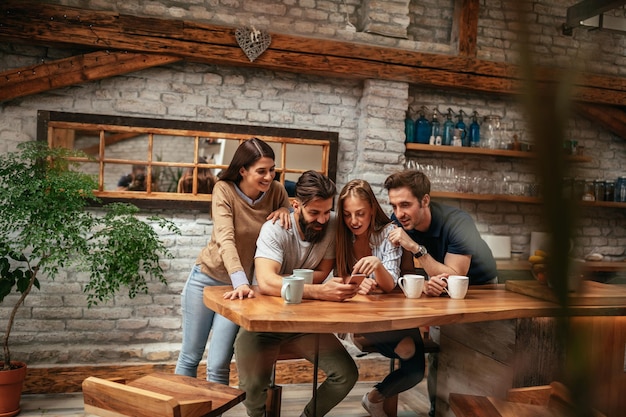 Group of friends browsing the social networks at home